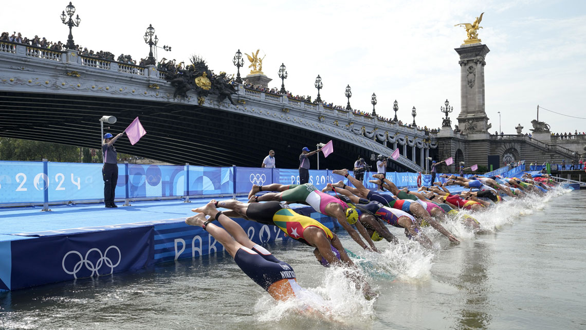 Olympic athletes jumping into Seine.